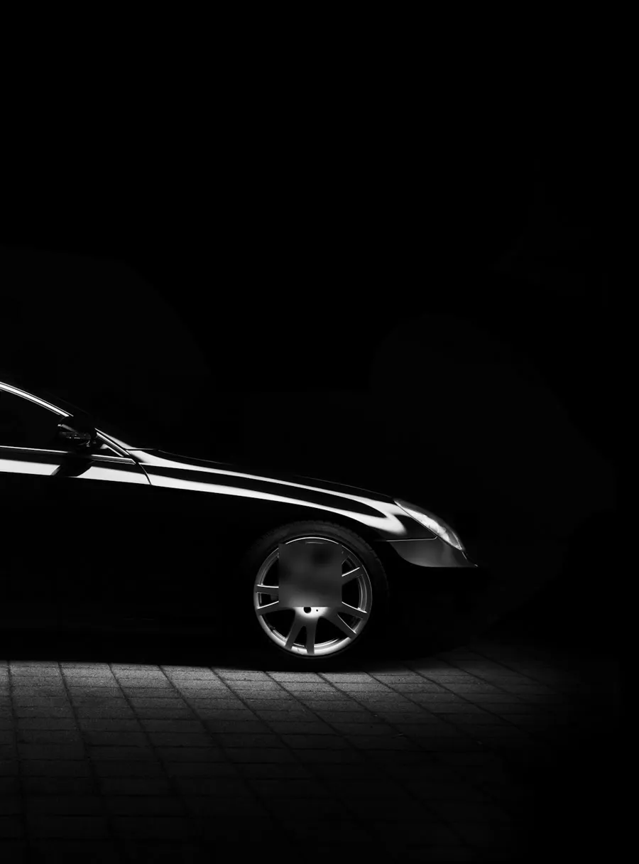 Black sedan in low light