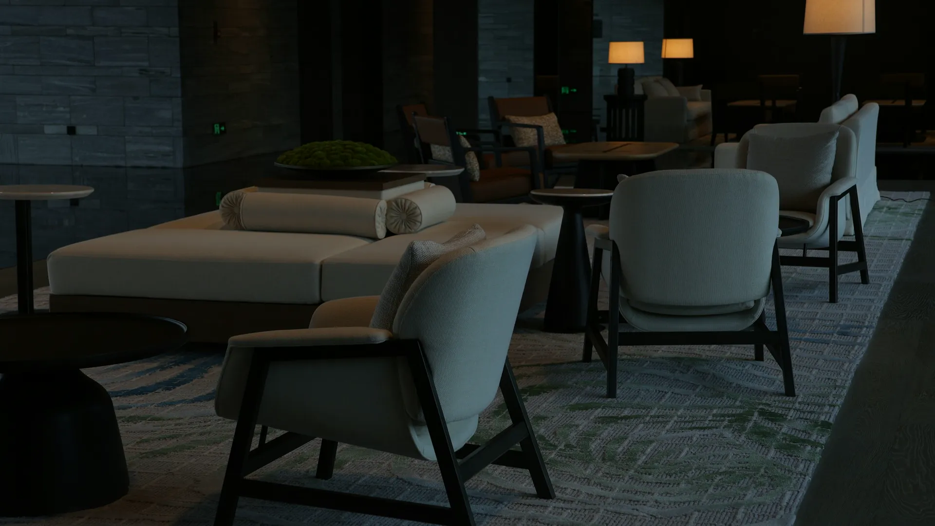 Quiet lounge with armchairs and warm lamps